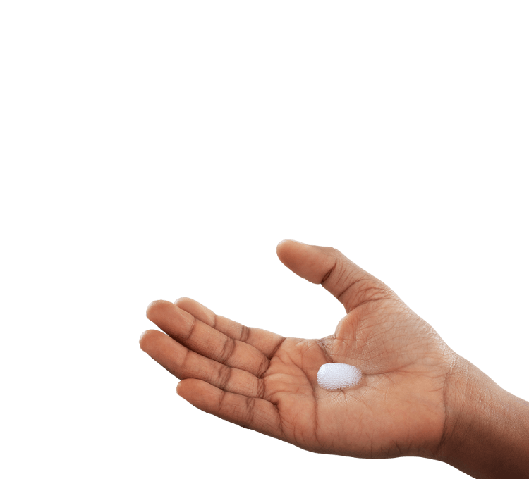 Hand with dab of ZORYVE topical foam in palm coming from canister