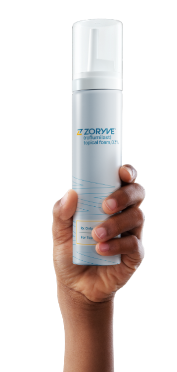 Hand holding ZORYVE topical foam canister