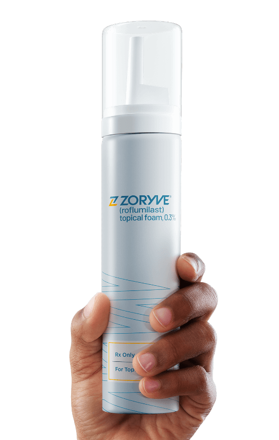 Hand holding ZORYVE topical foam canister